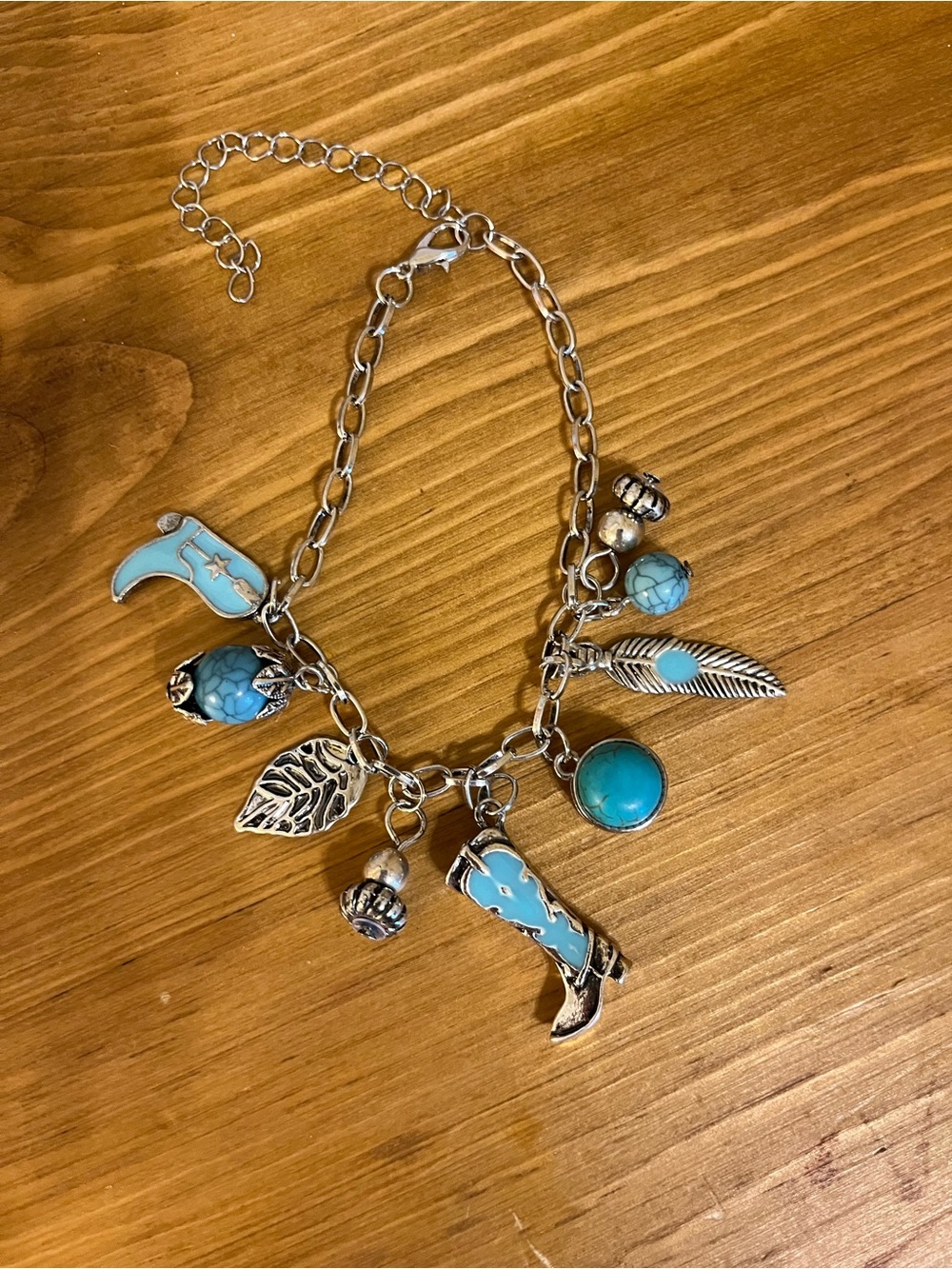 Cowboy charm bracelet with 9 charms lobster claw closure ext 7 1/4”